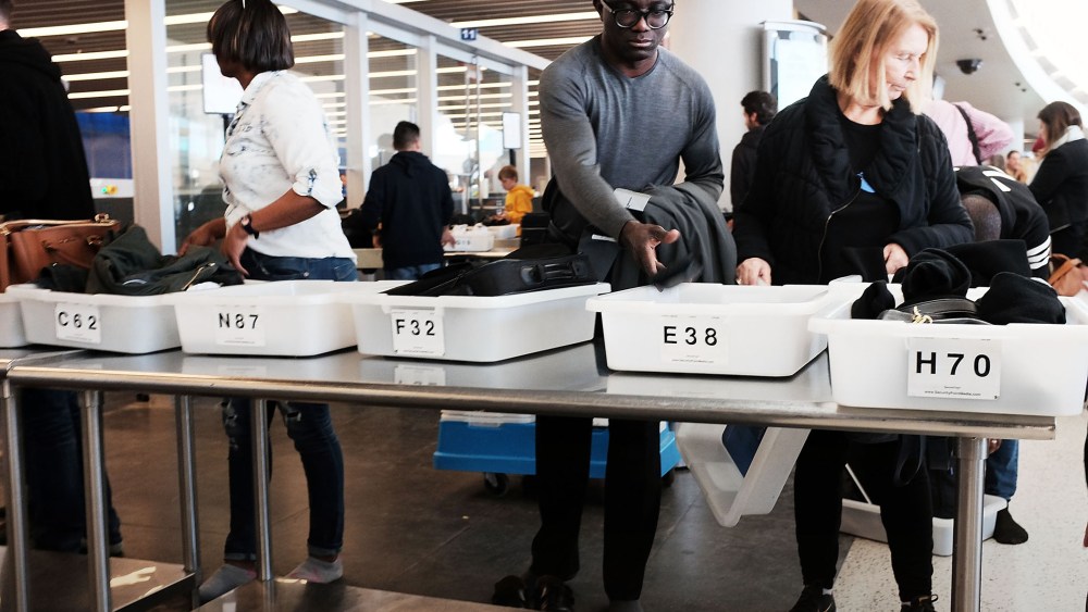 People go through security at JFK Airport, Nov. 25, 2015 in Queens, New York City. (Photo by Spencer Platt/Getty)