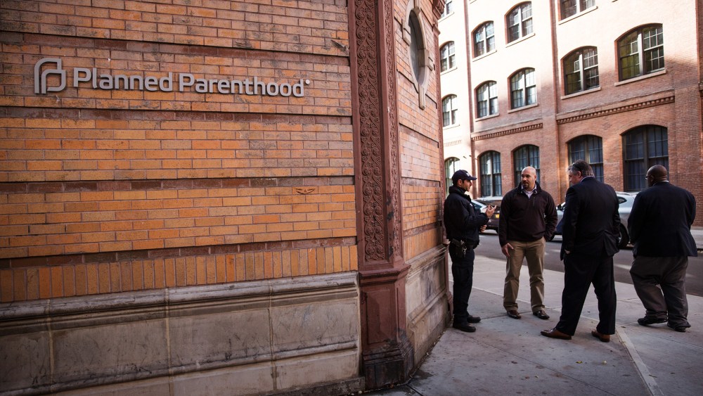 A police officer from the counterterrorism department stands guard outside Planned Parenthood on Nov. 30, 2015 in New York City. (Photo by Andrew Burton/Getty)