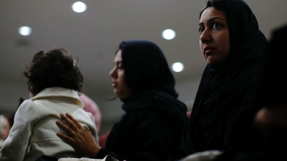 Muslim women look on during a prayer vigil for the victims of the San Bernardino shooting at Baitul Hameed Mosque on Dec. 3, 2015 in Chino, Calif. (Photo by Justin Sullivan/Getty)