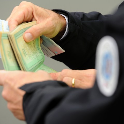 French police officers checks a person's papers at a border post on the French-Spanish border on the A63 motorway in Biriatou, southwestern France, on Dec. 4, 2015. (Photo by Iroz Gaizka/AFP/Getty)