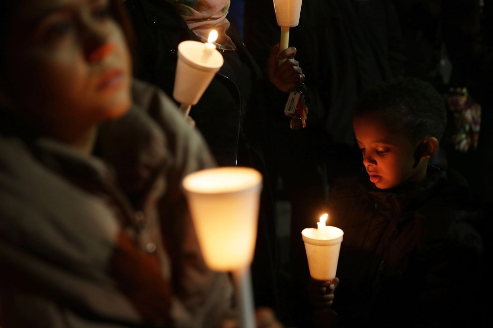 People participate in a candlelight vigil, held by the Council on American-Islamic Relations, for the victims in recent mass shootings Dec. 4, 2015 at the Muslin Community Center in Silver Spring, Md. (Photo by Alex Wong/Getty)