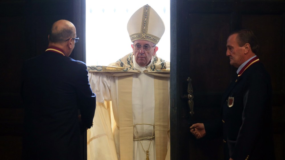 Pope Francis opens the Holy Door of St. Peter's Basilica on Dec. 8, 2015 in Vatican City, Vatican. (Photo by Vatican Pool/Getty)