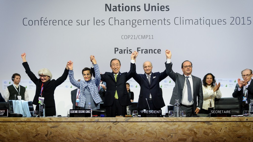 Executive Secretary of the UNFCCC Christiana Figueres, UN Secretary General Ban Ki Moon, President-designate of COP21 Laurent Fabius, and France's President Francois Hollande, Dec. 12, 2015. (Photo by Arnaud BOUISSOU/COP21/Anadolu Agency/Getty)