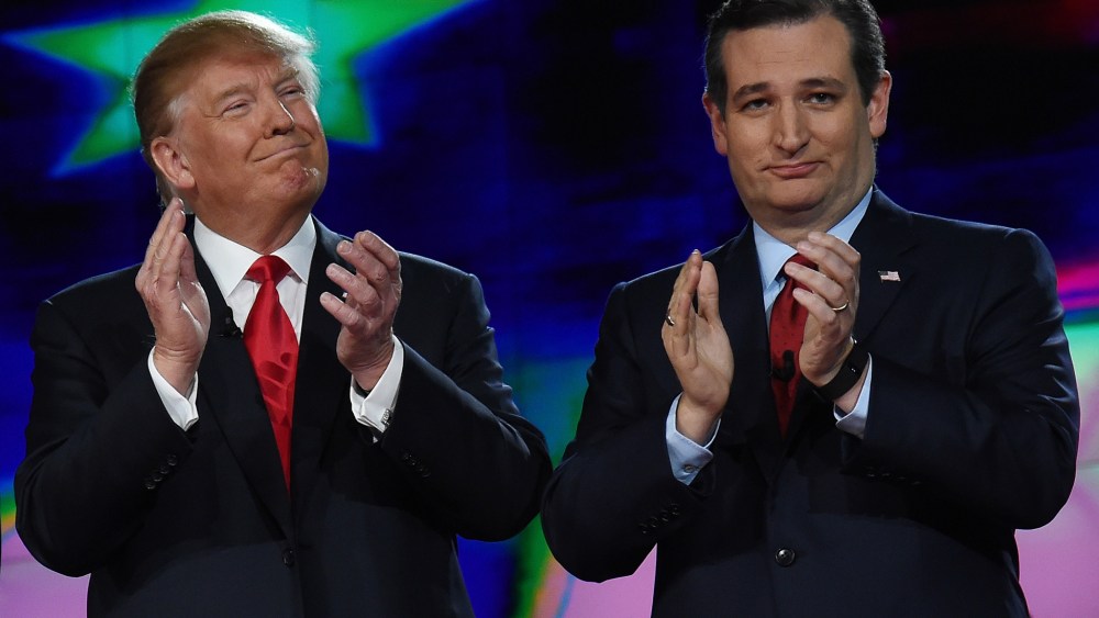 Republican presidential candidates Donald Trump and Sen. Ted Cruz (R-TX) applaud as they are introduced during the CNN presidential debate at The Venetian Las Vegas on Dec. 15, 2015 in Las Vegas, Nev. (Photo by Ethan Miller/Getty)