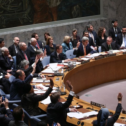 Foreign ministers vote during a UN Security Council meeting on Syria at the United Nations on Dec. 18, 2015. The Council on Friday unanimously adopted a resolution endorsing a peace process to end the Syrian war. (Photo by Cem Ozdel/Anadolu Agency/Getty)