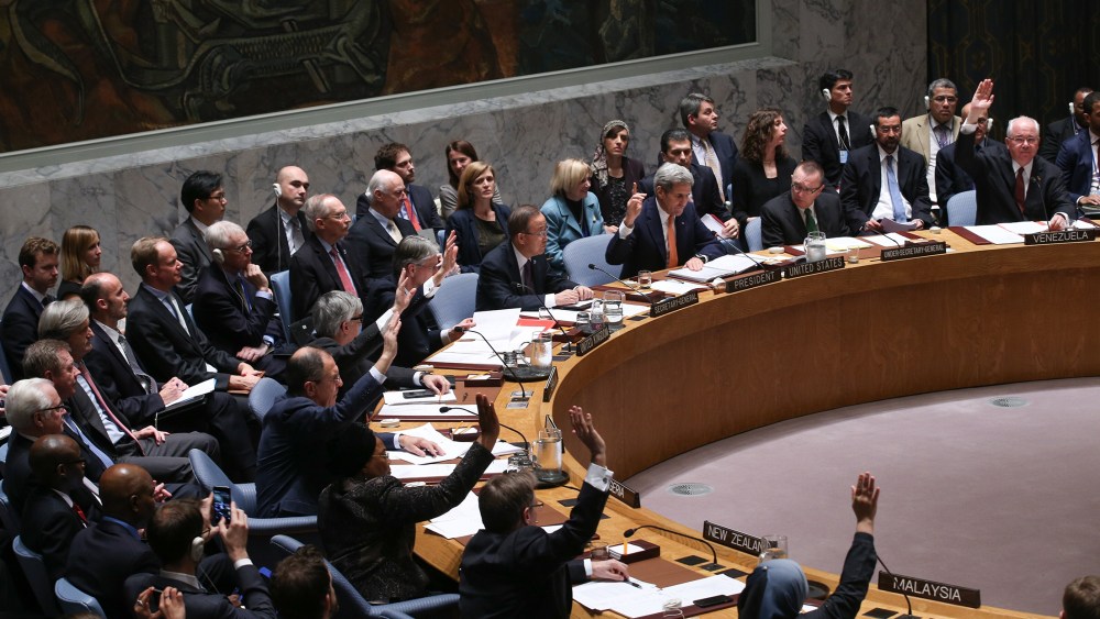 Foreign ministers vote during a UN Security Council meeting on Syria at the United Nations on Dec. 18, 2015. The Council on Friday unanimously adopted a resolution endorsing a peace process to end the Syrian war. (Photo by Cem Ozdel/Anadolu Agency/Getty)