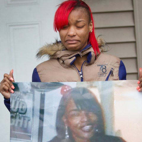 LaTonya Jones, the daughter of Bettie Jones, holds a picture of her mother during a vigil outside her home on Dec. 27, 2015 in Chicago, Ill. (Photo by Scott Olson/Getty)