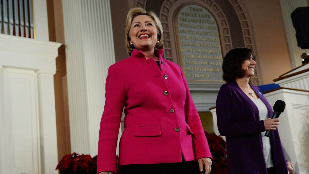 Democratic Presidential candidate Hillary Clinton listens as she is introduced at South Church Dec. 29, 2015 in Portsmouth, N.H. (Photo by Darren McCollester/Getty)
