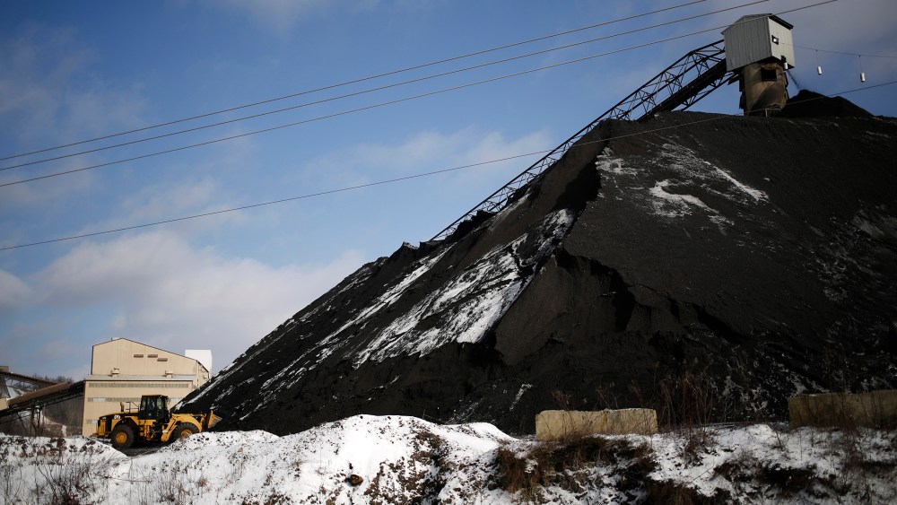 A Caterpillar Inc. front loader scoops coal from a mound at the Arch Coal Inc. Sentinel Prep Plant in Philippi, W.V., Jan. 13, 2016. (Photo by Luke Sharrett/Bloomberg/Getty)