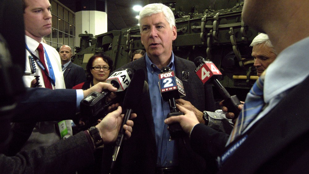 Michigan Governor Rick Snyder talks to reporters during the press preview for the 2016 North American International Auto Show at Cobo Hall, Jan. 12, 2016 in Detroit, Mich. (Photo by Paul Warner/Getty)