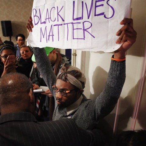 A Black Lives Matter protester is kept out of the main ballroom during the U.S. Conference of Mayors 84th Winter Meeting at the Capitol Hilton Jan. 20, 2016 in Washington, DC. (Photo by Chip Somodevilla/Getty)