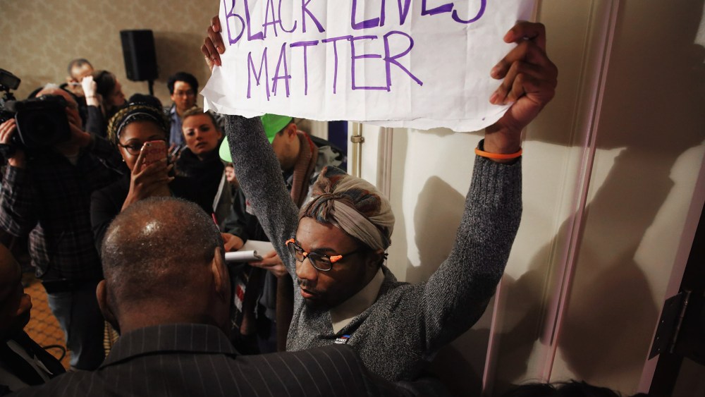 A Black Lives Matter protester is kept out of the main ballroom during the U.S. Conference of Mayors 84th Winter Meeting at the Capitol Hilton Jan. 20, 2016 in Washington, DC. (Photo by Chip Somodevilla/Getty)