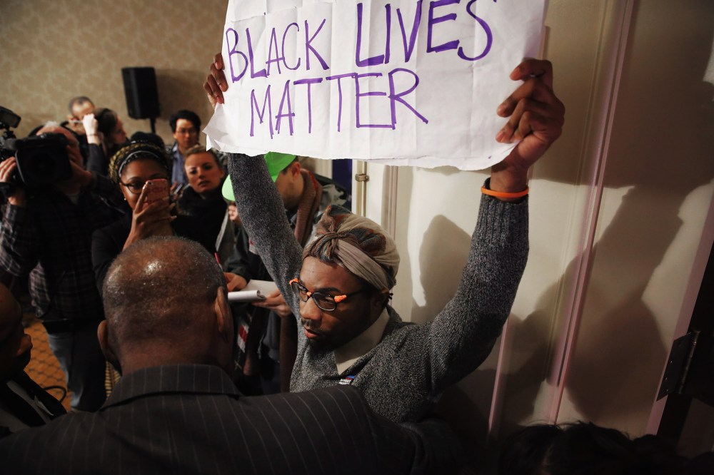 A Black Lives Matter protester is kept out of the main ballroom during the U.S. Conference of Mayors 84th Winter Meeting at the Capitol Hilton Jan. 20, 2016 in Washington, DC. (Photo by Chip Somodevilla/Getty)