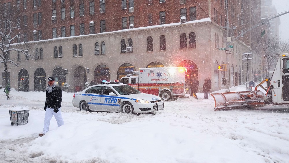 Emergency Vehicles in the empty streets in Chelsea during blizzard conditions on Jan. 23, 2016 in New York. (Photo by Jamie McCarthy/Getty)