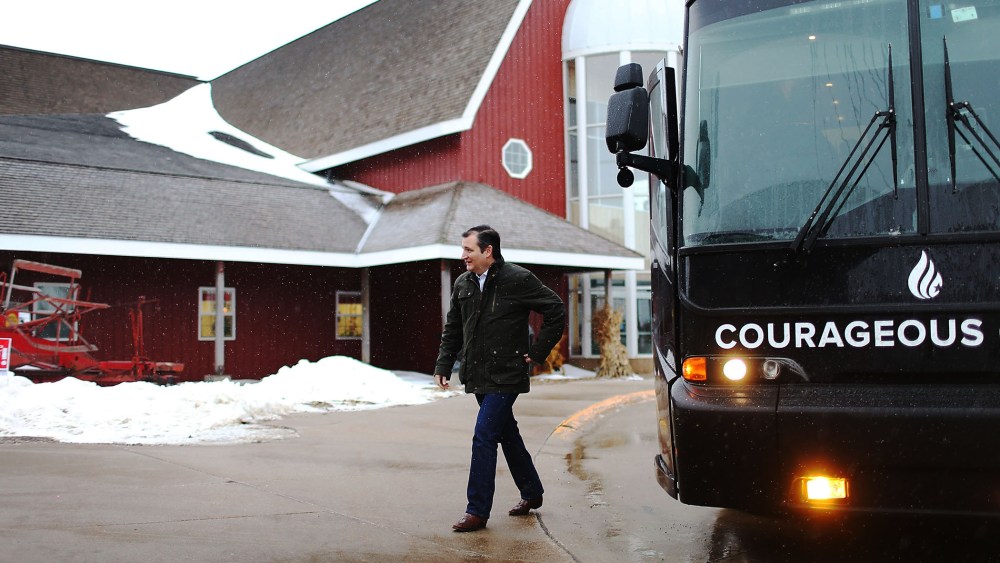 Republican presidential candidate Sen. Ted Cruz (R-TX) walks off his campaign bus for an event at the Heartland Acres Agribition Center on Jan. 25, 2016 in Independence, Iowa. (Photo by Joe Raedle/Getty)