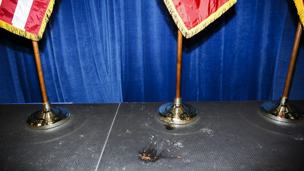 The remains of a tomato thrown by a protester at Donald Trump lies on the ground during an event in Iowa City, Iowa, on Jan. 26, 2016. (Photo by Patrick T. Fallon/Bloomberg/Getty)