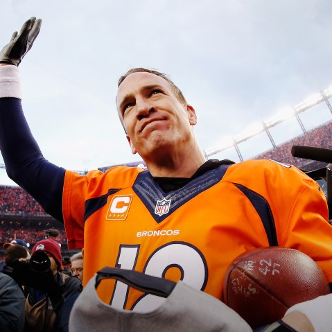 Quarterback Peyton Manning #18 of the Denver Broncos waves after defeating the New England Patriots at the AFC Championship game, Jan. 24, 2016 in Denver, Colo. (Photo by Christian Petersen/Getty)