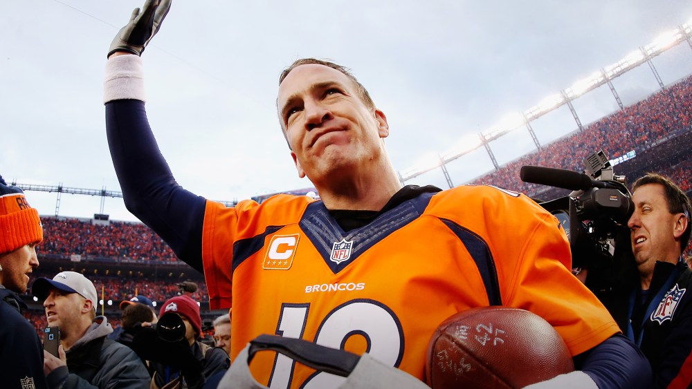 Quarterback Peyton Manning #18 of the Denver Broncos waves after defeating the New England Patriots at the AFC Championship game, Jan. 24, 2016 in Denver, Colo. (Photo by Christian Petersen/Getty)