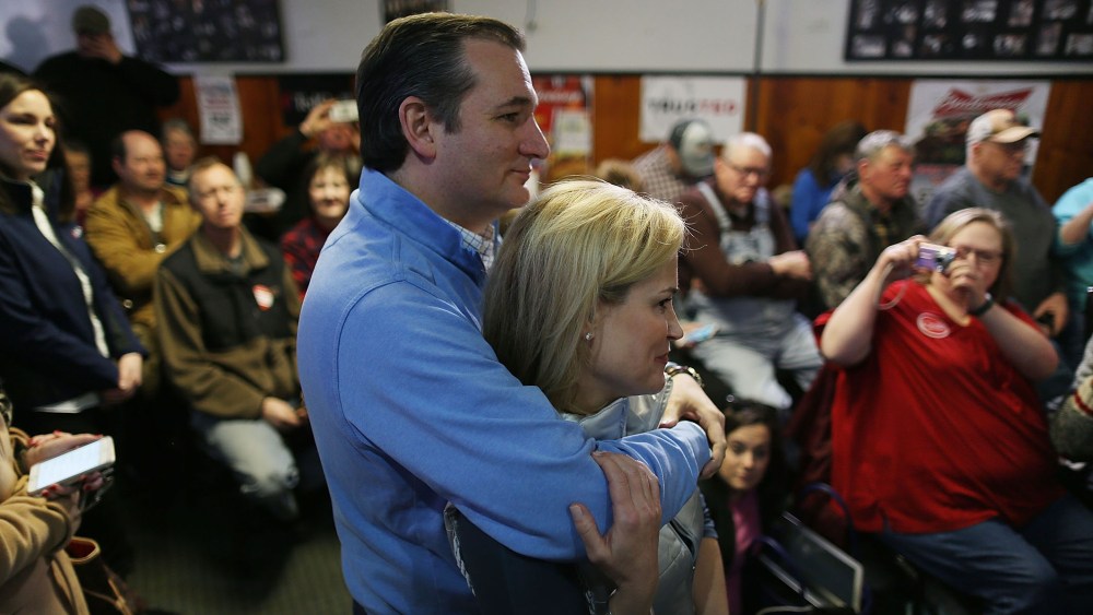 Republican presidential candidate Sen. Ted Cruz (R-TX) hugs his wife, Heidi Cruz, before he is introduced during a campaign event at 3 Generations Bar & Grill on Jan. 29, 2016 in Ringsted, Ia. (Photo by Joe Raedle/Getty)