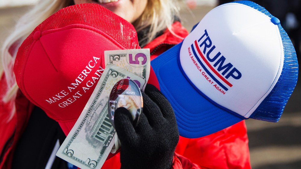 A vendor sells merchandise outside a rally for Republican presidential candidate Donald Trump at the airport on Jan. 29, 2016 in Dubuque, Iowa. (Photo by Scott Olson/Getty)