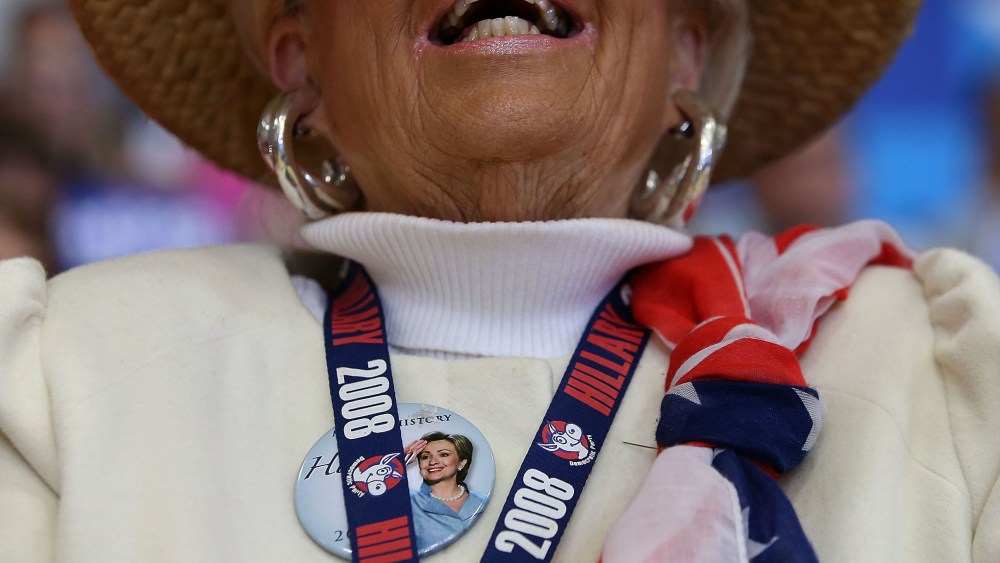 A supporter of democratic presidential candidate former Secretary of State Hillary Clinton cheers during a "get out to caucus" event at Washington High School on Jan. 30, 2016 in Cedar Rapids, Ia. (Photo by Justin Sullivan/Getty)