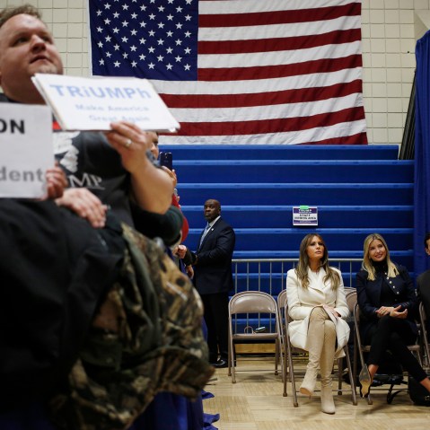As Donald Trump speaks, wife Melania Trump, seated left, daughter Ivanka Trump, daughter of Donald Trump, seated center, and son-in-law Jared Kushner listen offstage during a campaign rally in Council Bluffs, Iowa, U.S., on Jan. 31, 2016.