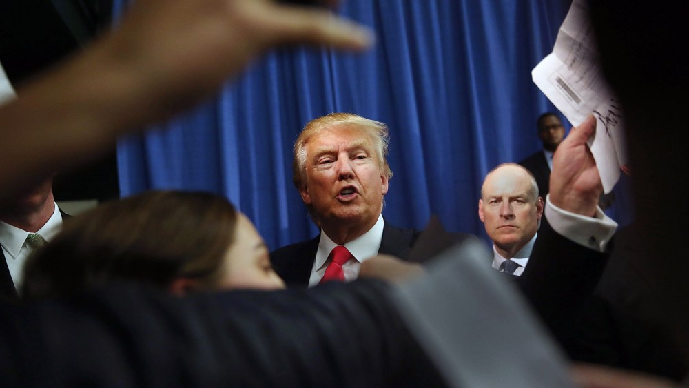 Republican Presidential candidate Donald Trump greets people in an overflow room during a campaign event at Hampshire Hills Athletic Club on Feb. 2, 2016 in Milford, Iowa. (Photo by Joe Raedle/Getty)