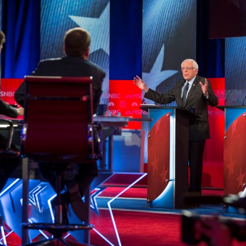 Hillary Clinton and Bernie Sanders appear during the "MSNBC Democratic Candidates Debate" on Feb. 4, 2016 at the University of New Hampshire. (Photo by Scott Eisen/MSNBC/NBCU Photo Bank/Getty)