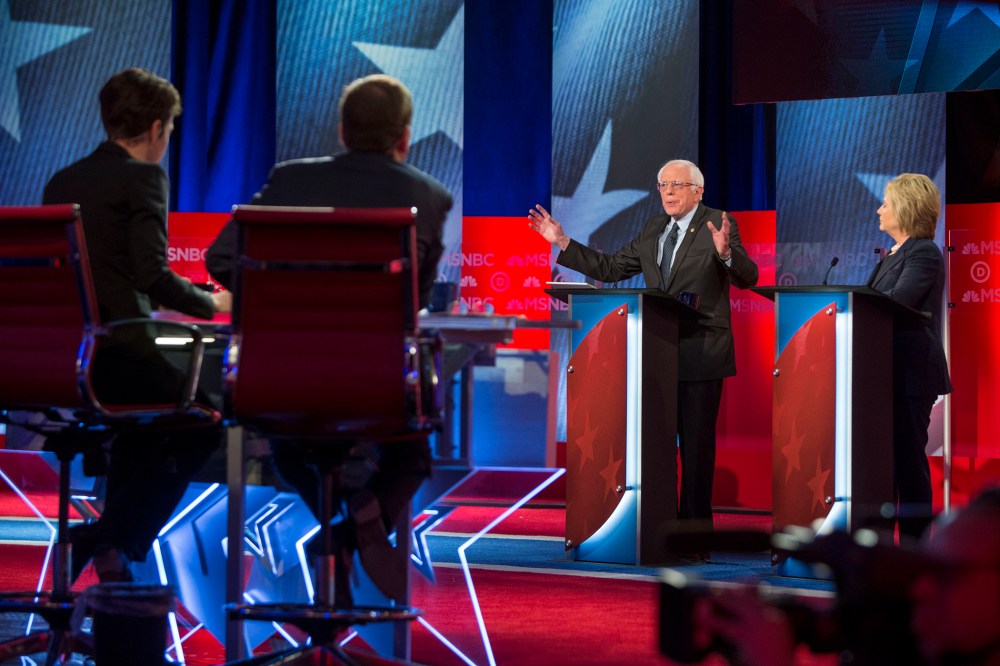 Hillary Clinton and Bernie Sanders appear during the "MSNBC Democratic Candidates Debate" on Feb. 4, 2016 at the University of New Hampshire. (Photo by Scott Eisen/MSNBC/NBCU Photo Bank/Getty)