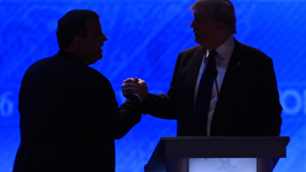 Republican presidential candidates Donald Trump (R) and Chris Christie (L) shake hands during a break in the Republican Presidential Candidates Debate on Feb. 6, 2016 in Manchester, N.H. (Photo by Jewel Samad/AFP/Getty)