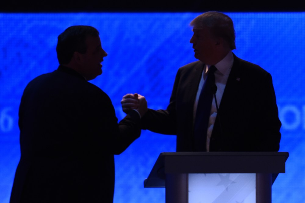 Republican presidential candidates Donald Trump (R) and Chris Christie (L) shake hands during a break in the Republican Presidential Candidates Debate on Feb. 6, 2016 in Manchester, N.H. (Photo by Jewel Samad/AFP/Getty)