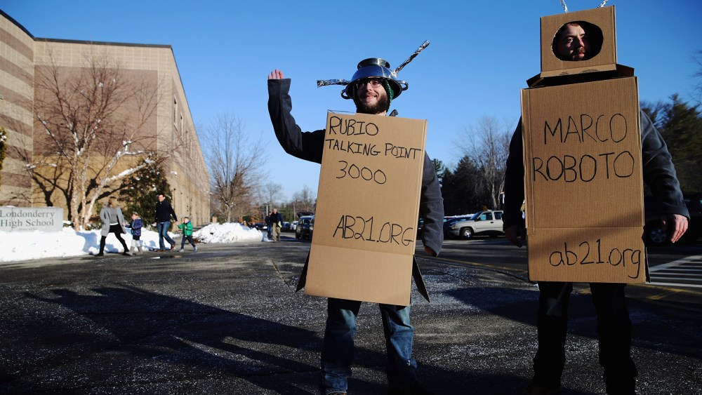 Workers from the American Bridge 21st Century super PAC wear robot costumes outside a Sen. Marco Rubio (R-FL) town hall in Londonderry, N.H., Feb. 7, 2016. (Photo by Chip Somodevilla/Getty)