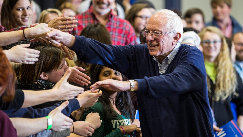 Democratic presidential candidate Sen. Bernie Sanders (D-VT) shakes hands with supporters at a campaign rally at Great Bay Community College on Feb. 7, 2016 in Portsmouth, N.H. (Photo by Andrew Burton/Getty)