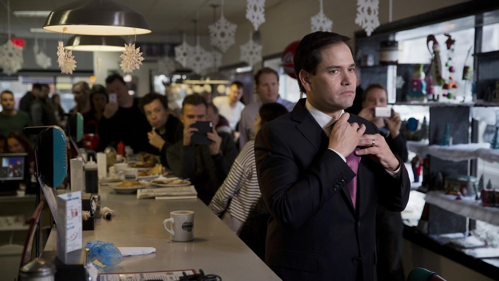 Senator Marco Rubio, a Republican from Florida and 2016 presidential candidate, adjusts his tie before an interview during a campaign stop at Norton's Cafe in Nashua, N.H., U.S., Feb. 8, 2016. (Photo by Victor J. Blue/Bloomberg/Getty)