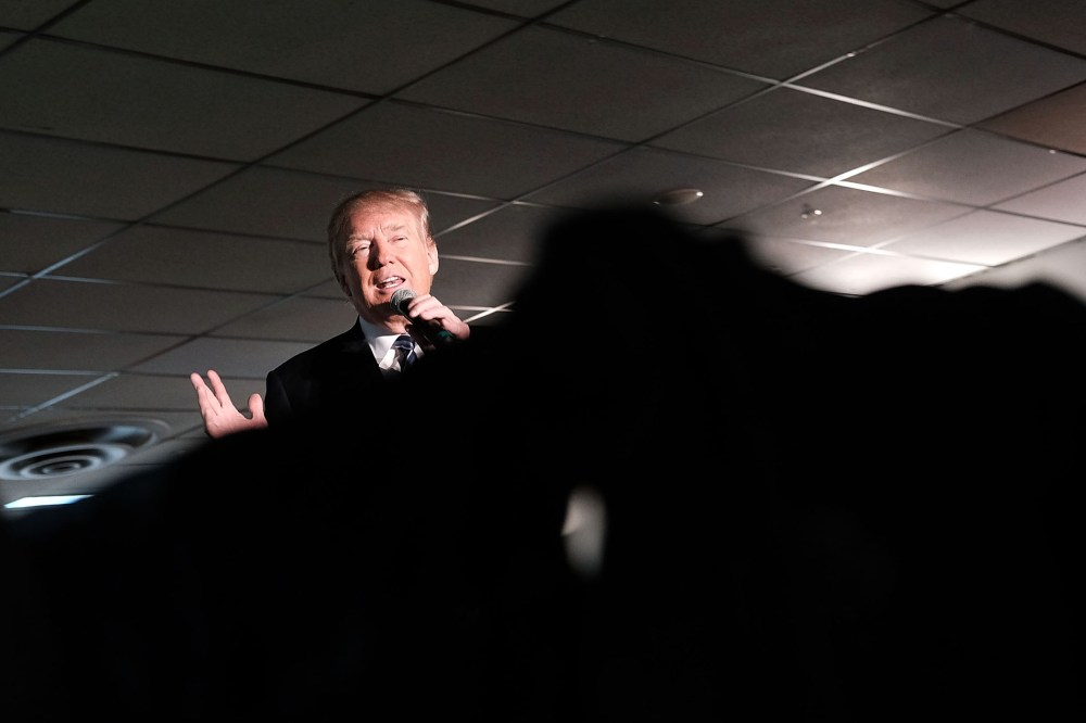 Republican presidential candidate Donald Trump speaks to a small crowd a day before voters go to the polls on Feb. 8, 2016 in Salem, N.H. (Photo by Spencer Platt/Getty)