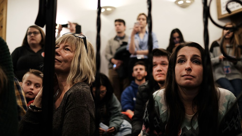 Voters watch Republican presidential candidate Ted Cruz speak at an American Legion on Feb. 8, 2016 in Manchester, N.H. (Photo by Spencer Platt/Getty)