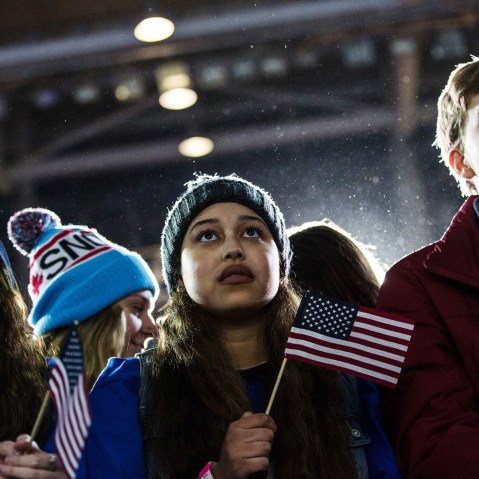Audience members listen to Democratic presidential hopeful, Sen. Bernie Sanders (D-VT) speak at a campaign rally and concert on Feb. 8, 2016 in Durham, N.H. (Photo by Andrew Burton/Getty)