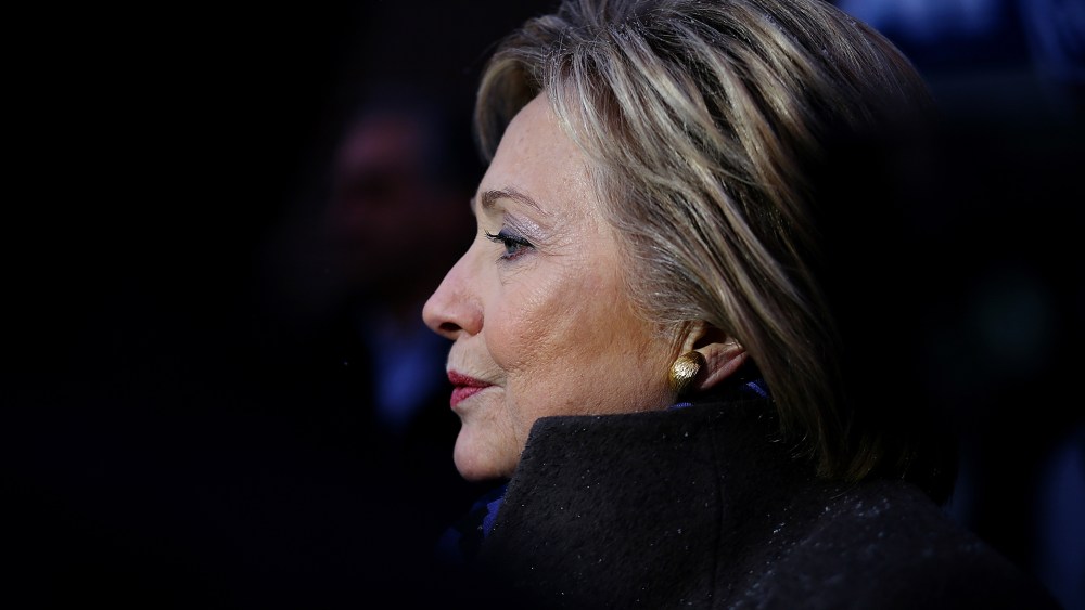 Former Secretary of State Hillary Clinton greets voters outside of a polling station at Parker Varney School on Feb. 9, 2016 in Manchester, N.H. (Photo by Justin Sullivan/Getty)