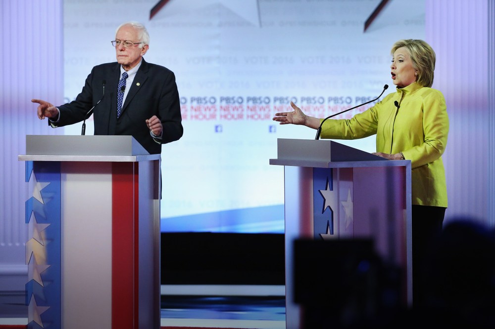 Democratic presidential candidates Senator Bernie Sanders and Hillary Clinton argue during the PBS NewsHour debate on Feb. 11, 2016 in Milwaukee, Wis. (Photo by Win McNamee/Getty)