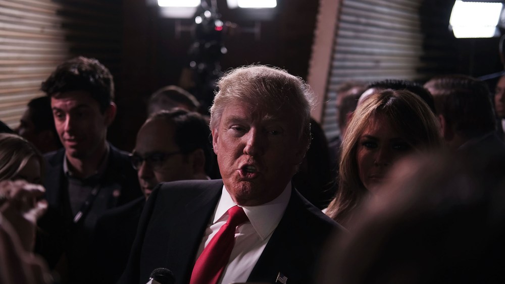 Presidential candidate Donald Trump speaks in the "Spin Room" following the Republican Presidential debate, Feb. 13, 2016 in Greenville, S.C. (Photo by Spencer Platt/Getty)