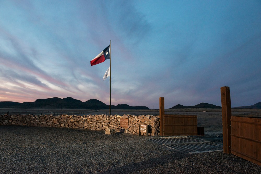 The Texas flag flies at the entrance to the Cibolo Creek Ranch in Shafter, Texas. (Photo by Matthew Busch/Getty)