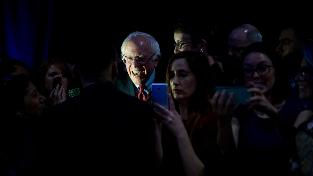 Presidential candidate Bernie Sanders poses for selfies with supporters after speaking during the Clark County Democratic Party Kick Off to Caucus Dinner at the Tropicana in Las Vegas, Nev., Feb. 18, 2016. (Photo By Bill Clark/CQ Roll Call/Getty)