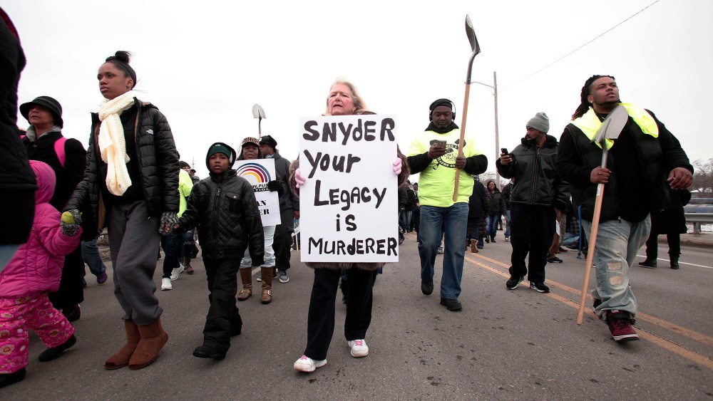 People participate in a national mile-long march to highlight the push for clean water in Flint, Feb. 19, 2016 in Flint, Mich. (Photo by Bill Pugliano/Getty)