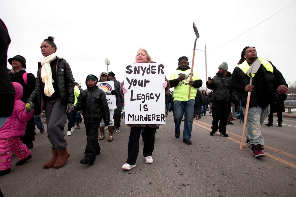 People participate in a national mile-long march to highlight the push for clean water in Flint, Feb. 19, 2016 in Flint, Mich. (Photo by Bill Pugliano/Getty)