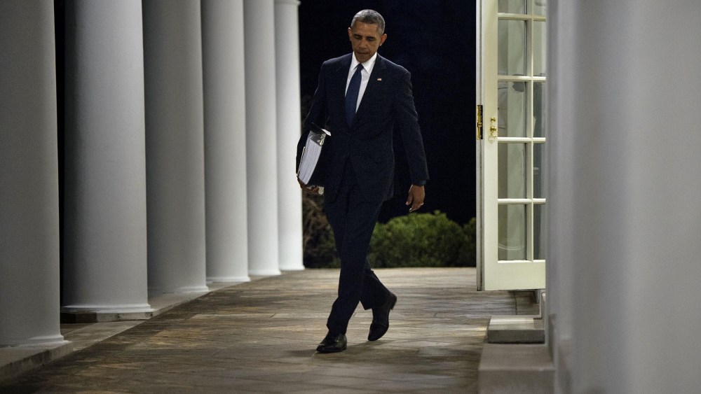 President Obama walks from the West Wing to the residence of the White House with a binder of potential Supreme Court nominees in Washington, Feb. 19, 2016. (Photo by Brendan Smialowski/AFP/Getty)