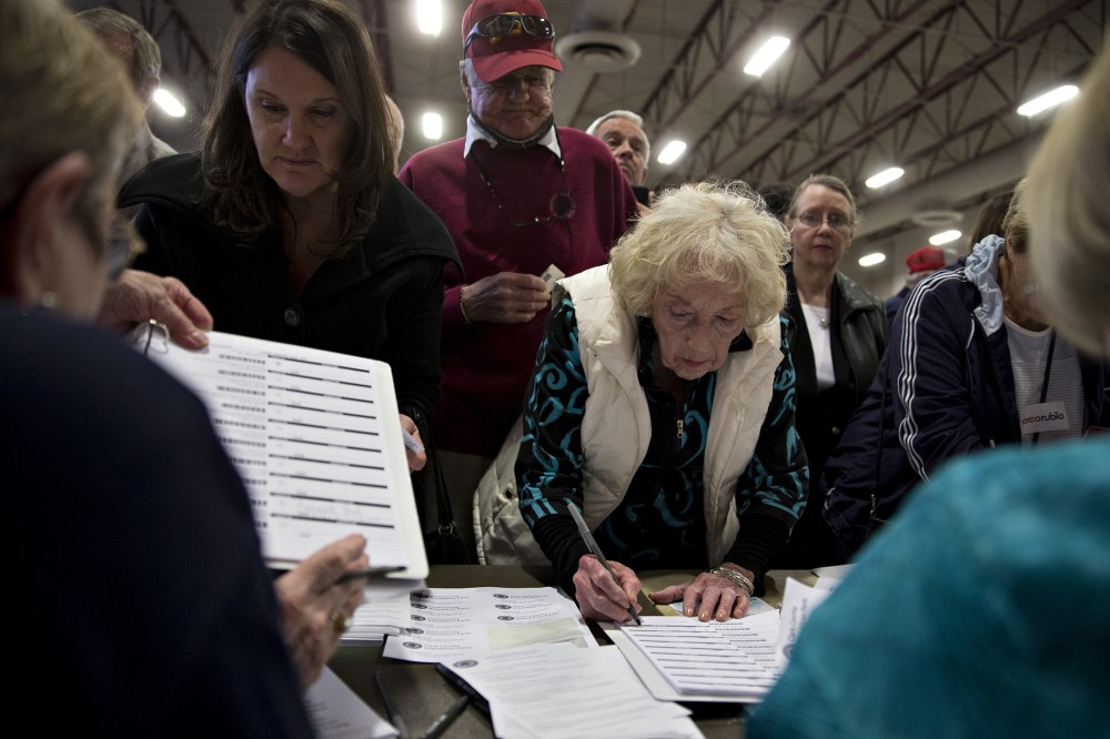 Caucusgoers check-in to receive a ballot at the Cimarron-Memorial High School caucus location during the Nevada Republican presidential caucus in Las Vegas, Nev., on Feb. 23, 2016. (Photo by Andrew Harrer/Bloomberg/Getty)