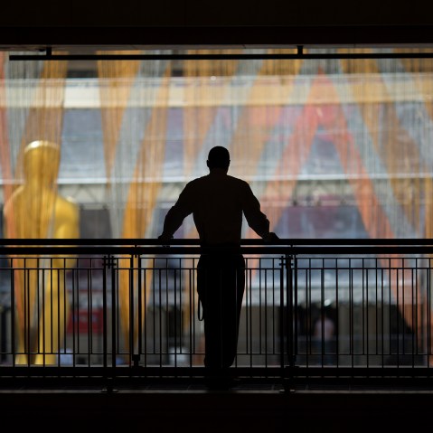 A security guard watches over operations near the primary Oscar statue as preparations are made for the 88th Annual Academy Awards at Hollywood & Highland Center on Feb. 24, 2016 in Hollywood, Calif. (Photo by David McNew/Getty)