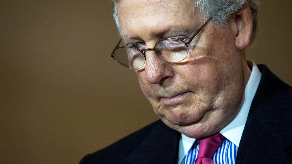 Senate Majority Leader Mitch McConnell (R-KY) bows his head in prayer during an event on Capitol Hill, Feb. 24, 2016 in Washington, D.C. (Photo by Drew Angerer/Getty)
