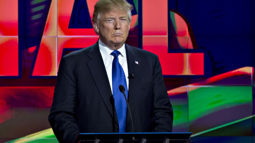 Donald Trump stands behind his podium during the Republican presidential primary candidate debate in Houston, Texas, Feb. 25, 2016. (Photo by Andrew Harrer/Bloomberg/Getty)