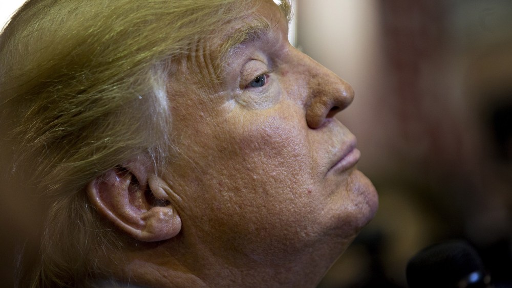 Donald Trump listens to a question while speaking to members of the media in the spin room after the Republican presidential primary candidate debate at the University of Houston in Houston, Texas, Feb. 25, 2016. (Photo by Andrew Harrer/Bloomberg/Getty)